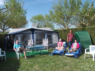 caravan, full awning, car, family and still grass showing!